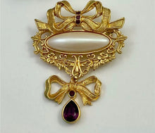Load image into Gallery viewer, Avon vintage 1990s Victorian Art Nouveau Renaissance ornate gold filigree bow brooch w faux pearl and purple crystal teardrop