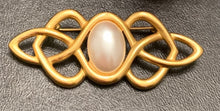 Load image into Gallery viewer, Vintage Anne Klein matte gold Celtic knotwork brooch with oval faux pearl cabochon