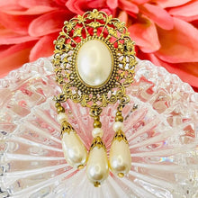 Load image into Gallery viewer, Beautiful Gilded Age Victorian goldtone filigree oval faux pearl cabochon brooch with teardrop dangles