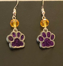 Load image into Gallery viewer, LSU Tigers or UNA Lions sports fan paw earrings: purple glitter enamel paw with optional gold crystal bead.