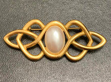 Load image into Gallery viewer, Vintage Anne Klein matte gold Celtic knotwork brooch with oval faux pearl cabochon
