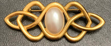 Load image into Gallery viewer, Vintage Anne Klein matte gold Celtic knotwork brooch with oval faux pearl cabochon
