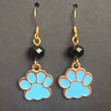 Load image into Gallery viewer, Helena Huskies paw print earrings: goldtone &amp; light blue enamel paw print with black bead
