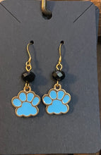 Load image into Gallery viewer, Helena Huskies paw print earrings: goldtone &amp; light blue enamel paw print with black bead
