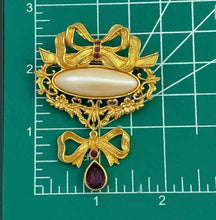 Load image into Gallery viewer, Avon vintage 1990s Victorian Art Nouveau Renaissance ornate gold filigree bow brooch w faux pearl and purple crystal teardrop
