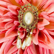 Load image into Gallery viewer, Beautiful Gilded Age Victorian goldtone filigree oval faux pearl cabochon brooch with teardrop dangles
