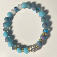 Load image into Gallery viewer, Blue Skies - Light blue iridescent ceramic beads with dark teal blue crystals, gold disc spacers, and white crystal pavé bead
