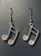 Load image into Gallery viewer, Silvertone music note earrings with rhinestones
