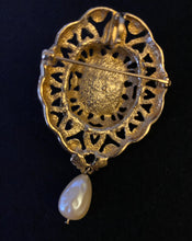 Load image into Gallery viewer, Vintage Avon ornate gold oval brooch / pendant w faux pearl cabochon and teardrop pearl dangle
