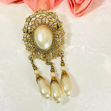 Load image into Gallery viewer, Beautiful Gilded Age Victorian goldtone filigree oval faux pearl cabochon brooch with teardrop dangles
