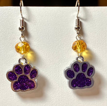 Load image into Gallery viewer, LSU Tigers or UNA Lions sports fan paw earrings: purple glitter enamel paw with optional gold crystal bead.
