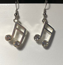 Load image into Gallery viewer, Silvertone music note earrings with rhinestones
