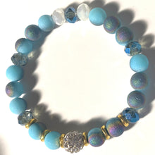 Load image into Gallery viewer, Blue Skies - Light blue iridescent ceramic beads with dark teal blue crystals, gold disc spacers, and white crystal pavé bead
