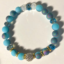 Load image into Gallery viewer, Blue Skies - Light blue iridescent ceramic beads with dark teal blue crystals, gold disc spacers, and white crystal pavé bead
